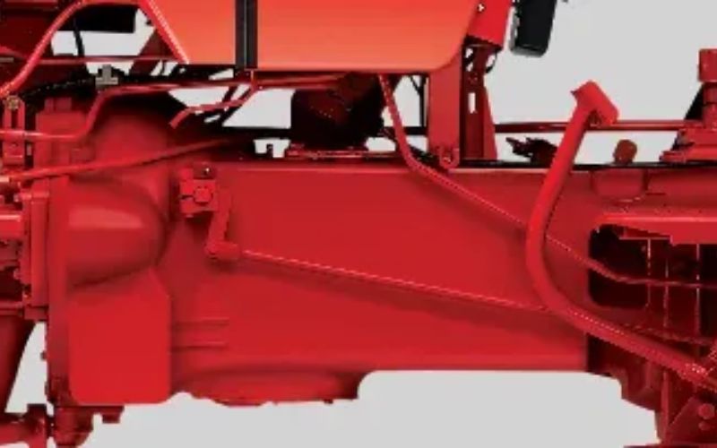 Side view of Mahindra 265 DI XP PLUS tractor chassis highlighting the structural framework and components.