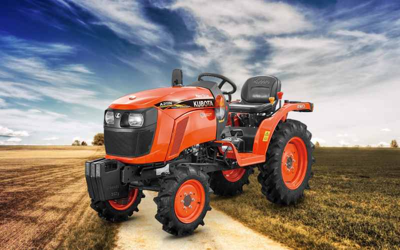 Kubota Neostar A211N-OP tractor on a farm path, known for its compact size and advanced features for modern agriculture.