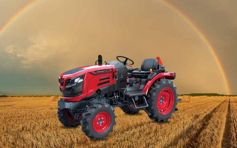 Mahindra Oja 2121 advanced tractor, red and black, suitable for agricultural fields