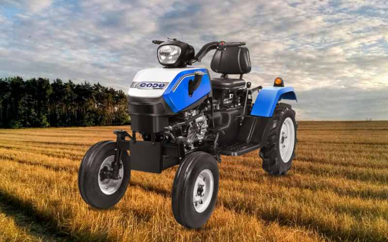 Swaraj Code mini tractor for field use, with blue and white design